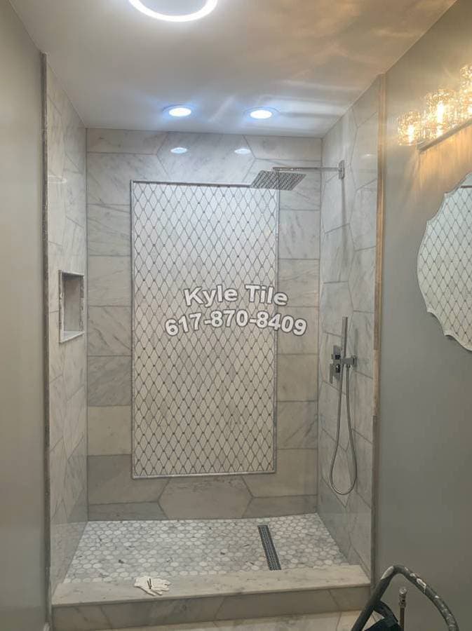 picture of a freshly tiled bathroom with a custom tile backsplash